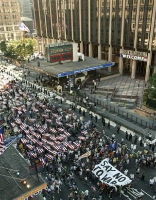 A group, carrying what was described as 1,000 coffins representing U.S. dead in Iraq (news - web sites), marches past Madison Square Garden during the anti-Bush march organized by United for Peace and Justice in New York Sunday, August 29, 2004, on the eve of the Republican National Convention. (AP Photo/Ted Warren) 