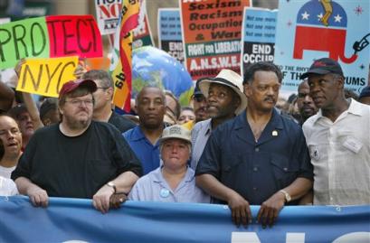 Filmmaker Michael Moore, left, protest organizer Leslie Cagan, second from left, the Rev. Jesse Jackson (news - web sites), second from right, and actor Danny Glover (news),right, lead a protest march by tens of thousands of Bush administration opponents on the eve of the Republican National Convention in New York, Sunday, Aug. 29, 2004. (AP Photo/Joe Cavaretta)
